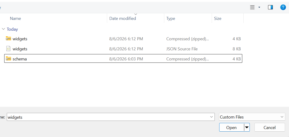 The native file picker, with an exported .json and .zip both available to choose from